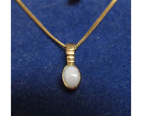 An opal pendant stamped 375 hung on a gold chain stamped 9kt, 40cm long, 3.3g