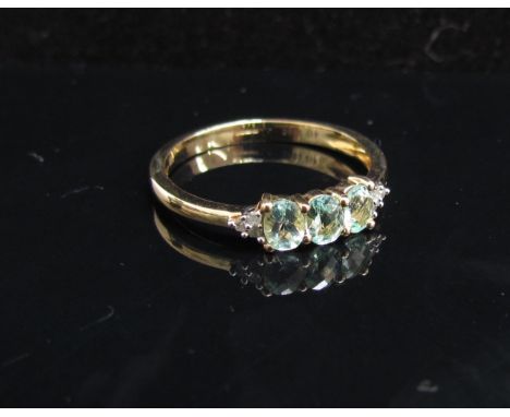 A 9ct gold Parouba tourmaline and diamond ring. Size N/O, 1.6g with certificate