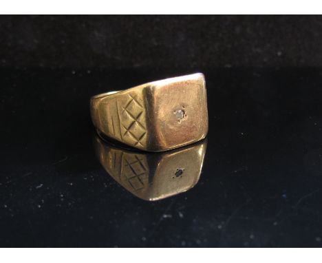 A 9ct gold signet ring with diamond chip centre, mis-shapen. Size R, 6.2g