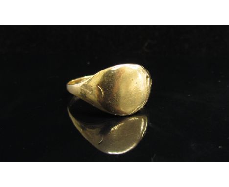 An 18ct gold signet ring, worn. Size U, 5.8g