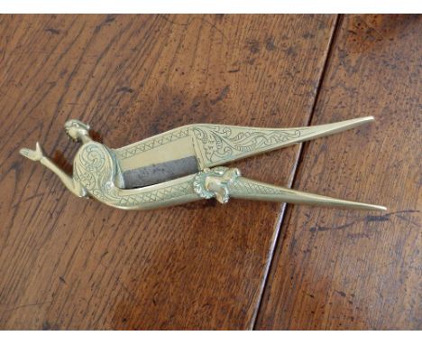 An Eastern brass figural beetle-nut cracker