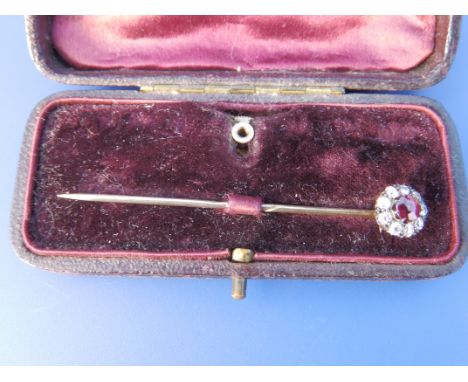 A ruby garnet & diamond cluster stick pin