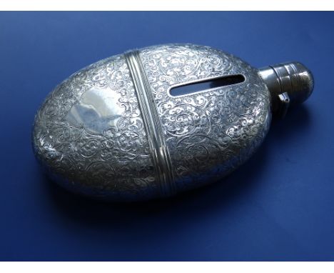 A Victorian engraved oval silver hip flask