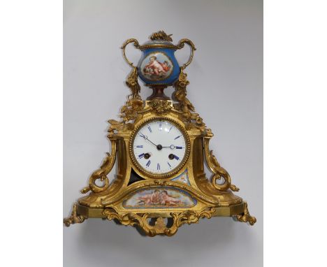 A 19thC French ormolu striking mantel clock – one small painted porcelain panel missing, 12” high