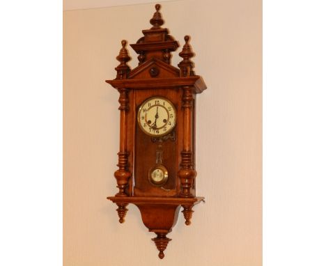 A 19thC German walnut cased striking wall clock, 36” high overall