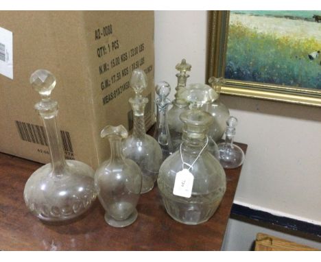 19TH CENTURY CUT GLASS DECANTER WITH STOPPER, 27cm high, along with eight other glass decanters (9)