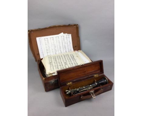 CASED CLARINET, stamped V.K.S, along with sheet music contained in a leather case, a cricker bat and tennis and other rackets