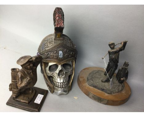 MODEL OF SKULL IN GLADIATOR HELMET, 31cm high, along with a golfing trophy, and a golfing figure