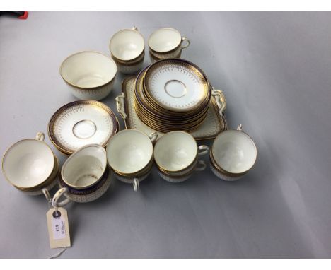 EDWARDIAN ROYAL DOULTON TEA SERVICE, BY ROBERT ALLAN, with gilt enamel and blue borders