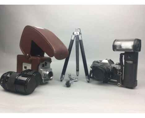 CANON AE-1 CAMERA, along with a Kodak Brownie Automatic Movie Camera, two lenses and a tripod stand in case