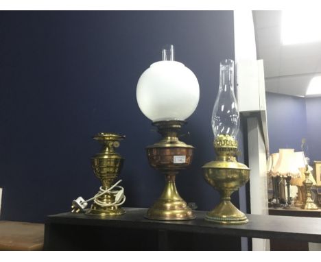 COPPER AND BRASS OIL LAMP, with funnel and opaque glass shade, along with a brass oil lamp and another, wired for electricity