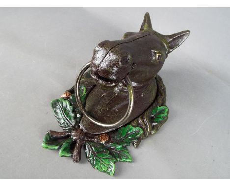 A cast horse head door knocker.