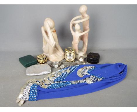 A mixed lot to include two stone sculptures, clocks, belly dancing hip skirt, watches, stud box, trinket box and similar.