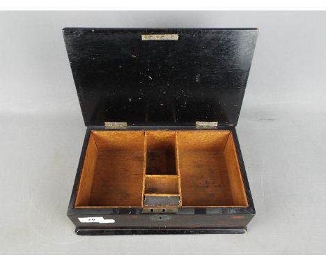 A Victorian trinket / cigarette box with hallmarked silver mounts, London assay 1897, approximately 8.5 cm x 27 cm x 17 cm.
