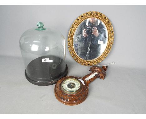 Lot to include a glass dome and stand, barometer with carved case and mirror. [3]