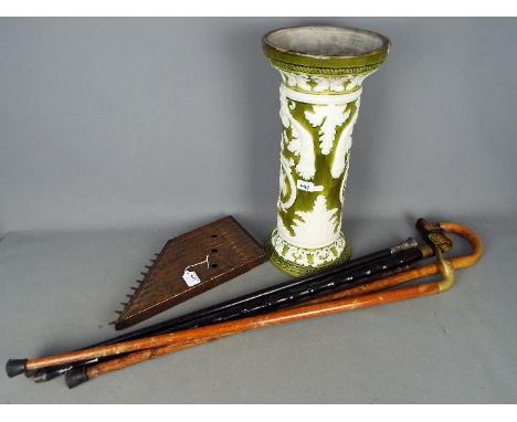 Lot to include a small collection of walking sticks, small harp and other. [2]