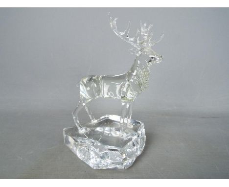 A studio glass, lamp worked figurine by Neil Harris depicting a stag, signed and dated to the base, approximately 16.5 cm (h)