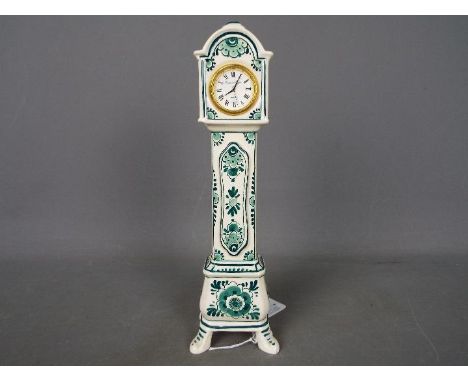 A hand painted green delft miniature longcase clock, approximately 24 cm (h)