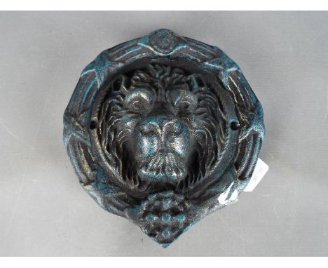 Door Furniture - a large cast door knocker in the form of a lions head