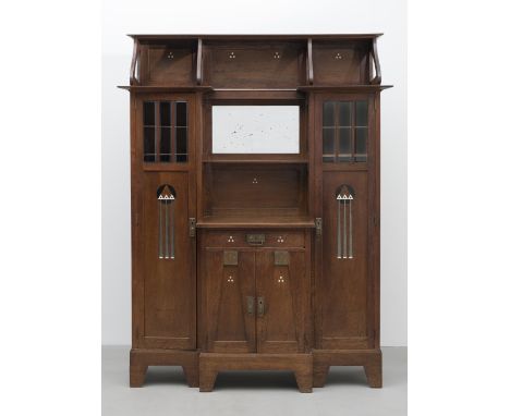 Vienna SchoolSeccessionist cabinet, circa 1900Oak, glass and with a bevelled mirror, decorated with stylised arrow motifs in 