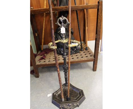 Cast iron stick stand and 2 sticks