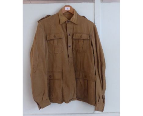 A German khaki coloured shirt with epaulettes (Please Note: this lot is subject to the statement made in the Auctioneers Glos