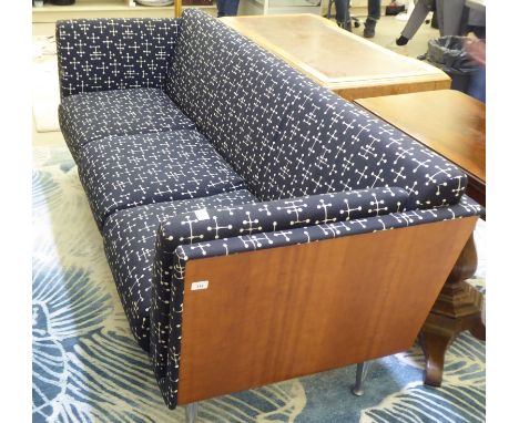 A Herman Miller sofa, designed by Mark Goetz, 'wrapped' in wood veneered panels and upholstered in cushioned black and white 