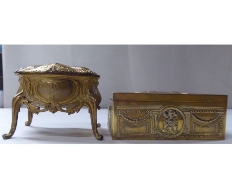 A late 19thC cast gilded metal jewellery box, fashioned as a commode, the hinged lid enclosing a quilted fabric interior&nbsp