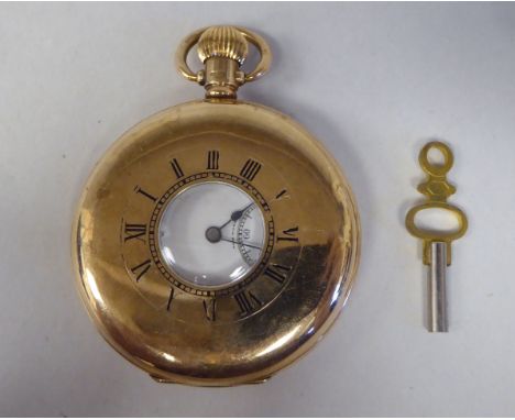 A 9ct gold cased half-hunter pocket watch, the movement faced by a white enamel Roman dial, incorporating a subsidiary 