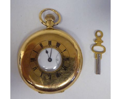 An 18ct gold cased half-hunter pocket watch, the movement faced by a white enamel Roman dial, incorporating a subsidiary 