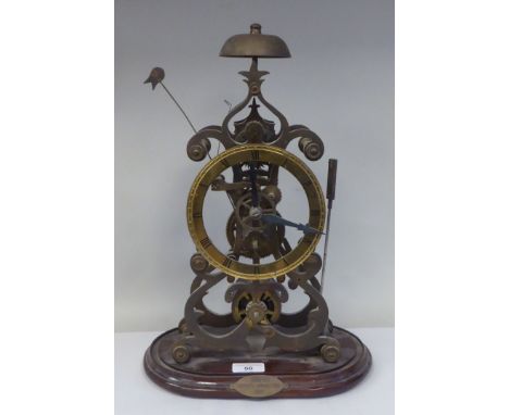 A traditional brass framed skeleton clock, reputed to have been made by Roxroth Apprentices 1985; the single fusee, bell stri