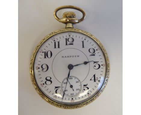An early 20thC Hampden pocket watch, in an 14ct gold fitted case, the 17 jewel movement faced by a white enamel Arabic dial, 