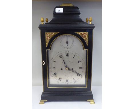 A George III James Asby, London, ebonised brass mounted bracket clock with pineapple finials and a folding top handle; the be