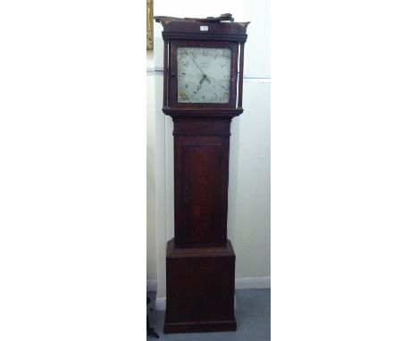 An early 19thC oak longcase clock; the 20 hour movement faced by a painted Arabic dial, inscribed W.Woolley Long&nbsp; 75"h 