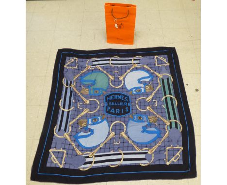 A Hermes silk and wool scarf, designed by H D'Origny&nbsp; 48"sq in a Hermes bag 