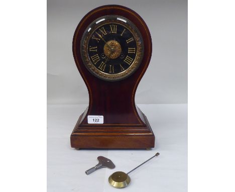 A late Victorian/Edwardian string inlaid mahogany balloon cased mantel clock; the gong strike movement faced by a gilded Roma