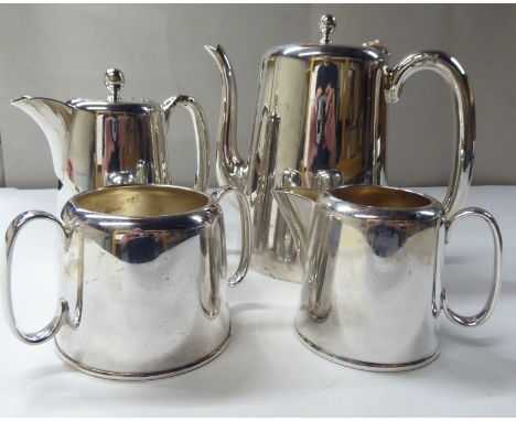 A four piece EPNS coffee set of tapered form, comprising a coffee pot, hot water pot, twin handled sugar basin and cream jug 