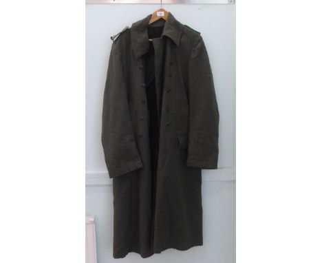 A German police greatcoat with epaulettes (Please Note: this lot is subject to the statement made in the Auctioneers Glossary
