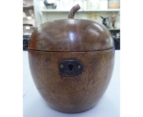 An early 19thC fruitwood tea caddy, fashioned as an apple with a hinged lid&nbsp; 5.5"h 