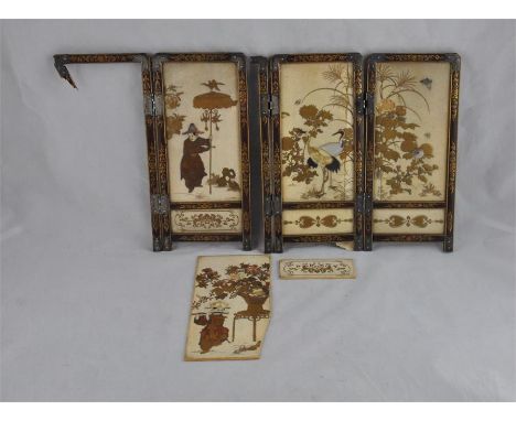 A fine quality Japanese Meiji Period (1868-1912) ivory shibiyama double sided miniature four fold screen, the panels richly d