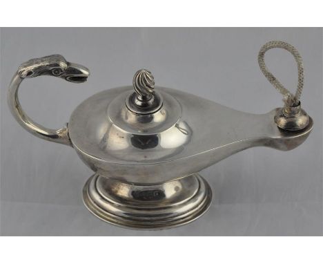 A silver table cigar lighter, by S W Smith &amp; Co, Birmingham 1917, modelled as an oil lamp, with engraved birds' head hand