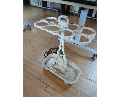 A Victorian white painted cast iron stick stand, with eight apertures on an acanthus support, height 85cm.