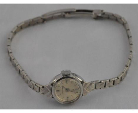 A Hamilton ladies' 9ct. white gold mechanical bracelet watch, having circular raised baton champagne dial, engine turned brac