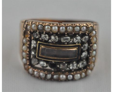 A Georgian yellow metal, diamond, seed pearl and black enamel mourning ring,&nbsp;having curved rectangular hinged panel, thi