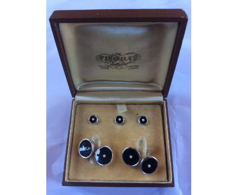 A 14ct. gold, black onyx and seed pearl cufflink and stud set, of circular form, the cufflinks with gently domed yellow gold 