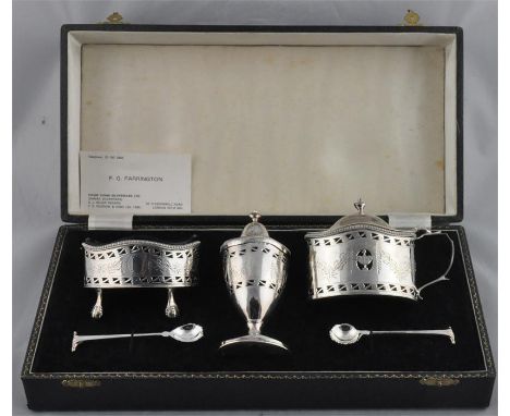 A boxed silver cruet set, by D J Silver, London 1974, of ovoid form and in the neo-classical style, comprising a mustard with