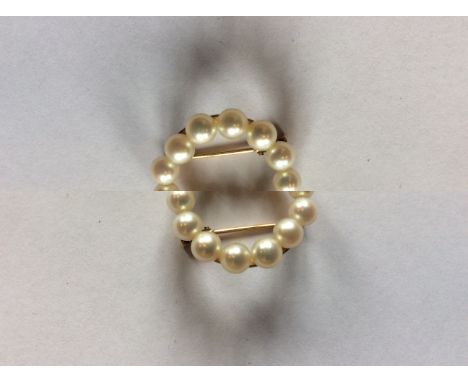 A 14ct. gold and pearl brooch, having ring form yellow gold mount set&nbsp;cultured pearls, stamped "K14". (gross weight 3.3g