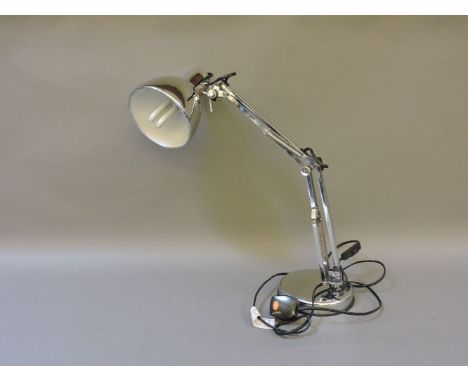 A modern chrome anglepoise lamp