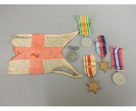 A 'Tobruk' staff car flag, inscribed 'Battle for Tobruck (sic) 11/11/41 - 6/12/41 DDMS 30 Corps 7SA CCS dive bombed 6/12/41, 