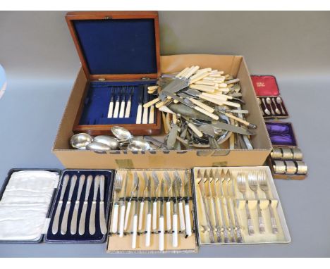 Two sets of six silver tea/coffee spoons, a set of six plated napkin rings, and a quantity of plated flatware